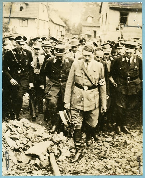 Hitler inspecting bombing damage in Germany